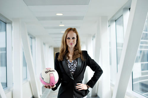 Julia Schel, R+T Park Rec League Organizer holding Volleyball