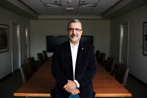 University of Waterloo President Feridun Hamdullahpur standing in board room